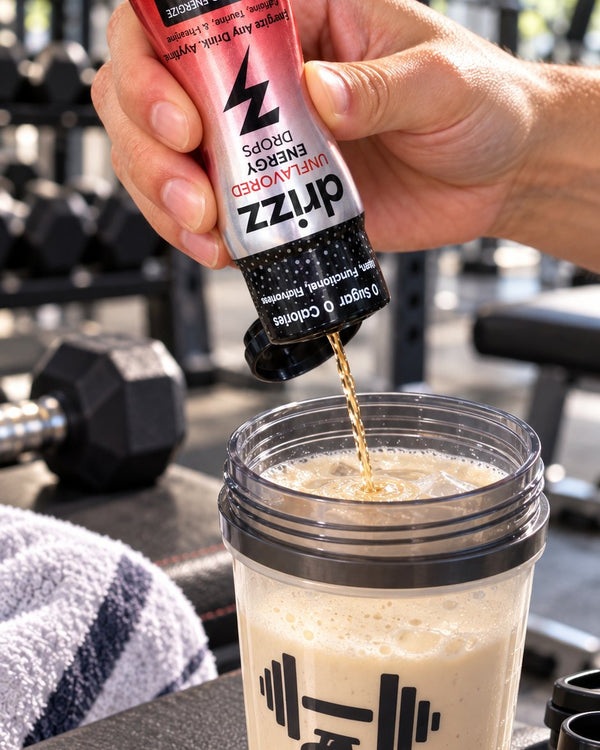 Squeezing Drizz Energy Drops into a protein shake at the gym