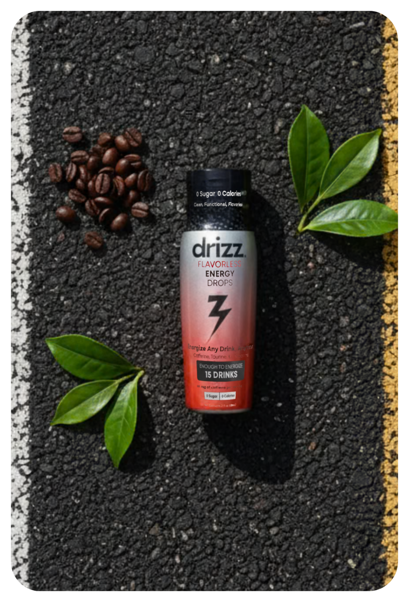Drizz energy drink can on a textured surface with coffee beans and leaves