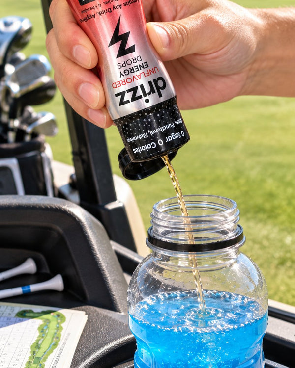 Squeezing Drizz Energy Drops into a sports drink on a golf cart